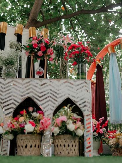 A creative bangle bar setup for a Mehendi event, allowing guests to choose their own colorful bangles as party favors.