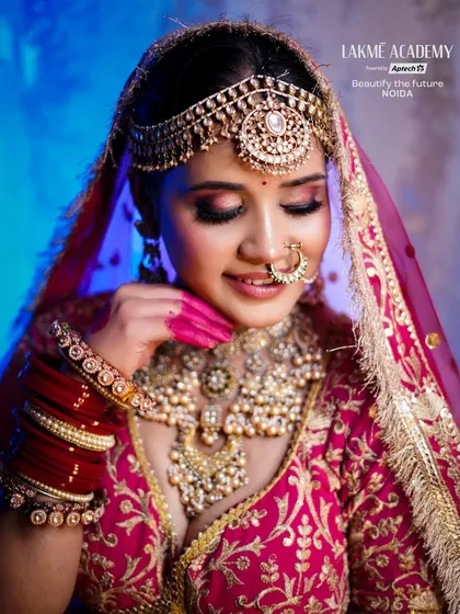 A close-up of a smiling bride, showcasing the flawless makeup and intricate details of her jewelry. Our courses emphasize creating looks that are beautiful both in person and on camera.