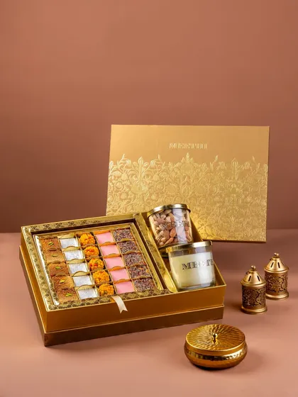 A luxury Indian sweet and dry fruit gift box for Meethi India. This product photography is styled for a festive theme, focusing on the premium packaging and the assortment of products to create an attractive image for e-commerce and catalogs.