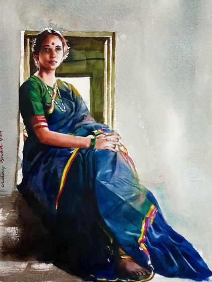 This watercolor painting of a woman in a blue sari is a study in capturing a relaxed, natural pose. The light coming from the window creates a beautiful contrast and sense of depth.