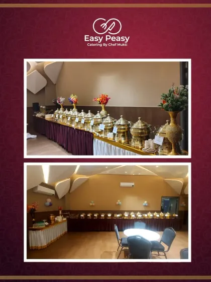 An elegant buffet line in a beautifully designed banquet hall. The warm lighting and architectural details of the venue are complemented by our classic catering setup.