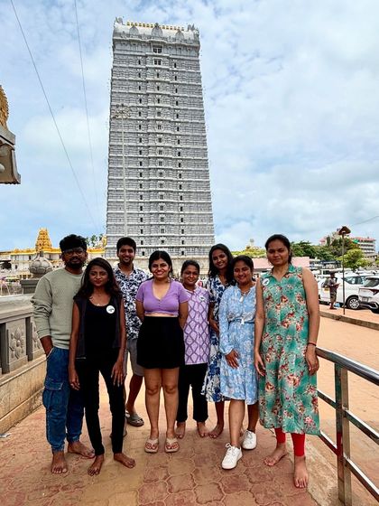 A group photo in front of the towering gopuram of the Murudeshwar temple. My coastal trips often include visits to iconic cultural landmarks like this.