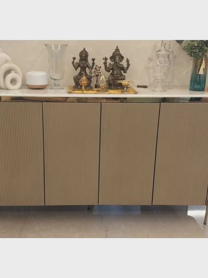 A frontal view of the ribbed sideboard, shown here used as a prayer or display surface. Its minimalist design and high-quality materials make it a durable and stylish addition to the home.