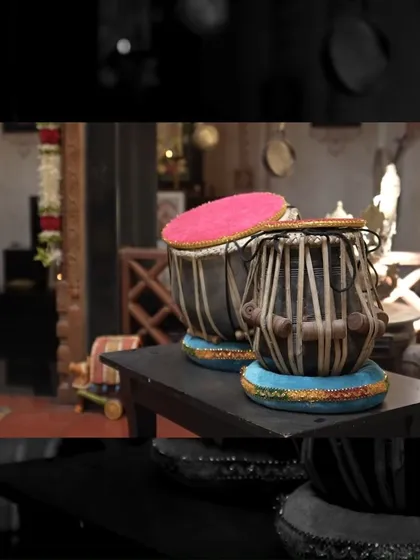 A close-up of a tabla set, hinting at the artistic and cultural life that unfolds within the Padmaja Rao Residence.