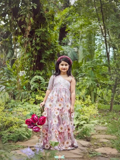 Taking the fun outdoors. This portrait, taken in a beautiful Bangalore park, shows how we use natural light and scenery to create magical, storybook-like kids' photos.