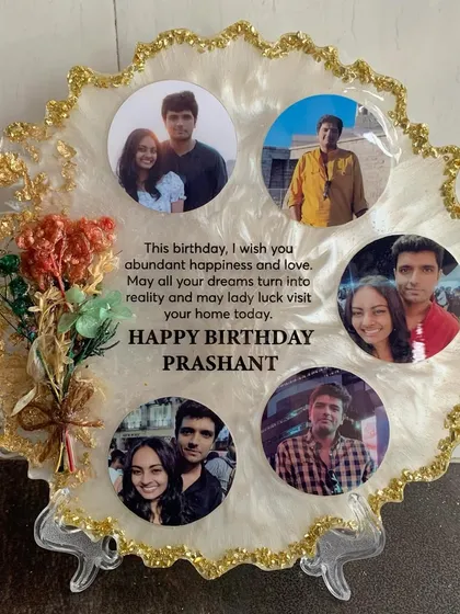Another view of the custom birthday frame, showing the arrangement of photos and the elegant script.