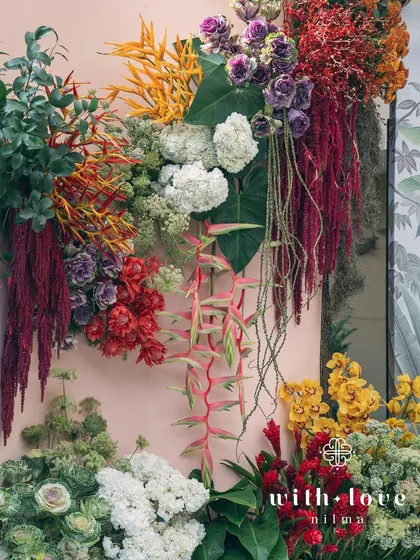 The full view of the 'Garden of Gaia' floral backdrop, a true testament to nature's abundance.