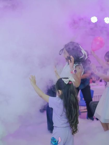 Kids playing in the harmless, dense fog created during the Mad Science show. It's a multi-sensory experience they will never forget.