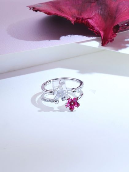 The "Two Flowers Ring," a floral dream in pink. This double ring features pear-cut pink rubies and diamonds in a whimsical, spotlight-stealing design.