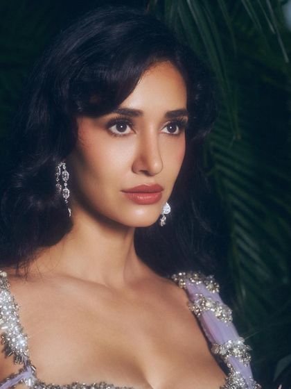 Another angle of this beautiful traditional look. The makeup is blended seamlessly to look flawless from every angle, ensuring it's camera-ready for any special occasion.