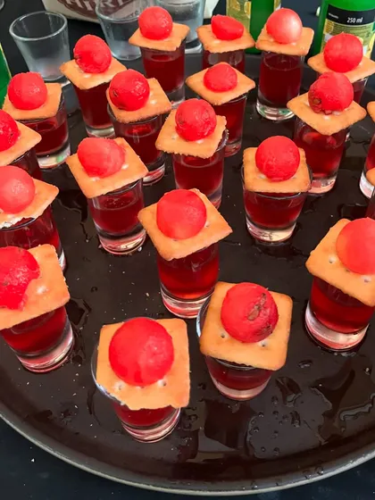 A tray of our signature Jamun shots ready to go. These are perfect for getting the party started and are a must-try at any celebration.