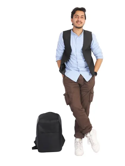 A full-length shot of a male model with a backpack, showing a complete look. This type of lifestyle shot is great for lookbooks and social media.