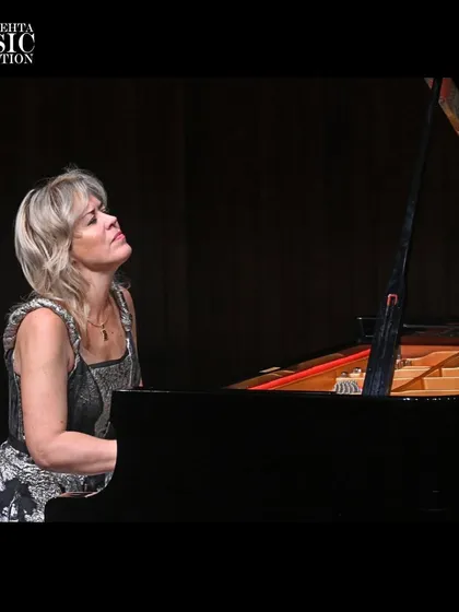 A moment of quiet reflection from pianist Olga Kern during her performance. Her recital featured a demanding program of works by Schumann, Gershwin, and Rachmaninov.