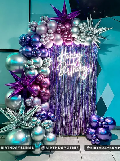 Another angle of the purple and silver fringe backdrop, showing the reflection and light play.