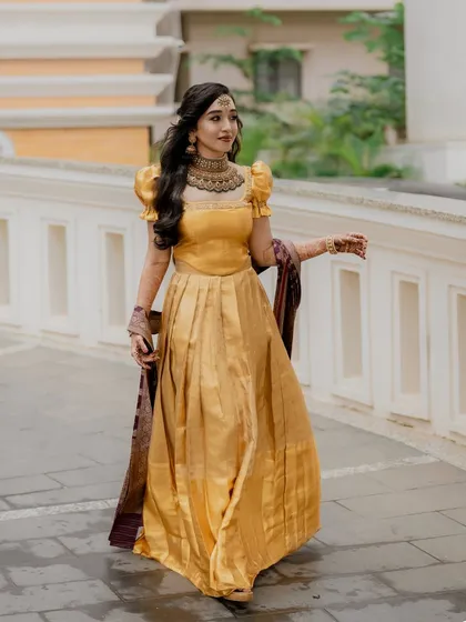 A candid walking shot, showing the beautiful movement of the gown. The makeup and hair are styled to look perfect from every angle.