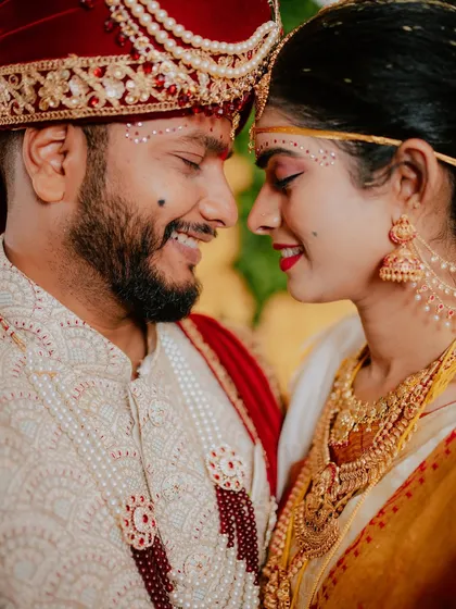 A beautiful close-up portrait capturing the smiles and connection between the bride and groom on their wedding day.