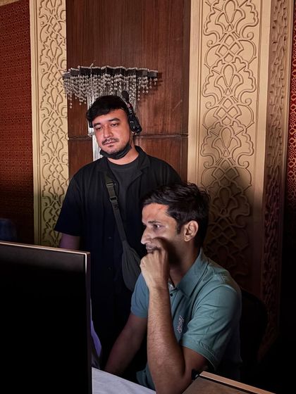 Our team members focused on their tasks at the technical console. Teamwork is essential for a smooth execution.