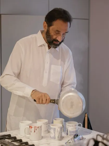 The bride's father making adrak waali chai for everyone at home on the morning of the wedding. It’s these simple, authentic acts of love and service that form the heart of a wedding story.