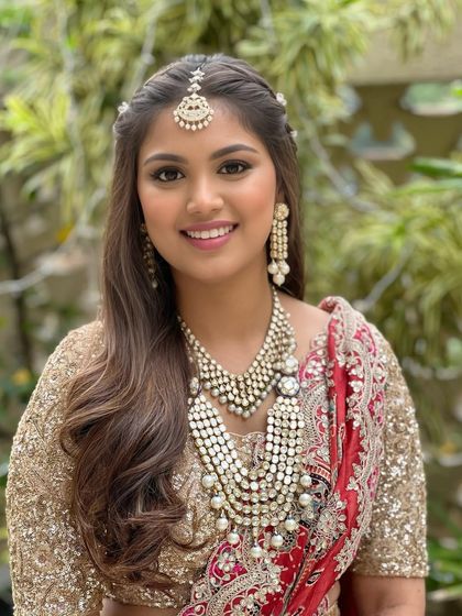 A happy and confident bride-to-be, ready to start her wedding journey. The makeup is designed to enhance her natural beauty and make her feel special.