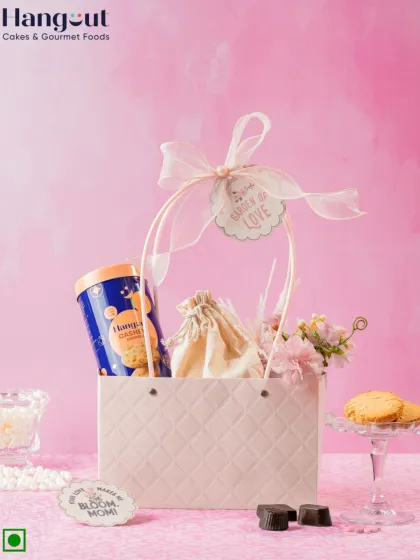 I designed this dreamy gift hamper for Mother's Day. It includes a cozy mug, my special gluten-free cookies, and other sweet treats, all wrapped in a beautiful bag to celebrate mom with love.