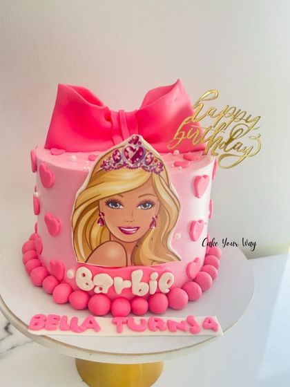An all-time favorite, this Barbie-themed cake is pretty in pink with a big fondant bow.