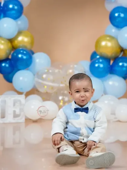 A cheeky wink for the camera. I love capturing these little personality quirks that make each child's session unique.