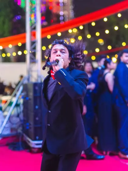 Our vocalist Aryaman getting the crowd hyped during a Christmas Eve party. We love to move around the stage and interact with the audience to keep the energy high.