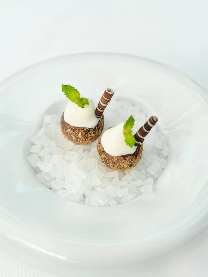 A dessert crafted by Chef Shantanu Mehrotra as part of our tasting menu. These bites of tender coconut and dark chocolate are a study in balance, both light and indulgent.