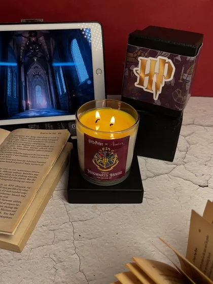 Let the magic decide your Hogwarts house. This Harry Potter themed candle reveals your house color as it burns. Which one will it be?