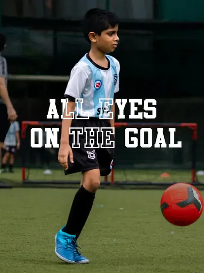 With eyes locked on the goal, this young footballer demonstrates intense focus. We help players develop the concentration and determination needed to succeed.