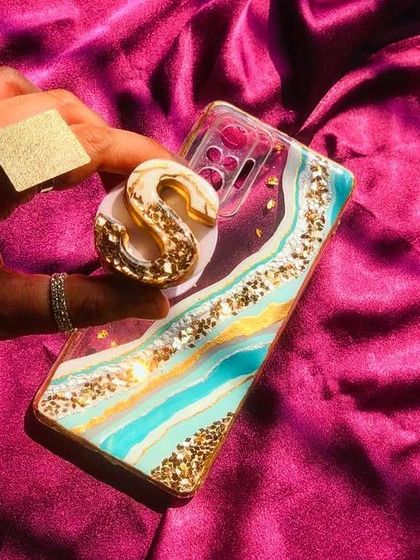 Go bold with a geode-style resin phone case! This one has beautiful teal and gold waves and comes with a matching initial pop-socket. I can customize this for any phone model.