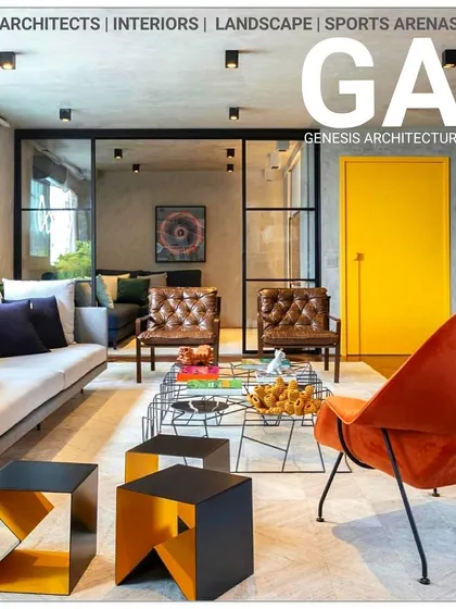 We love playing with color and texture to create vibrant interiors. In this space, a bold yellow door, rich leather chairs, and geometric furniture come together to form a modern and inviting atmosphere that feels full of life.