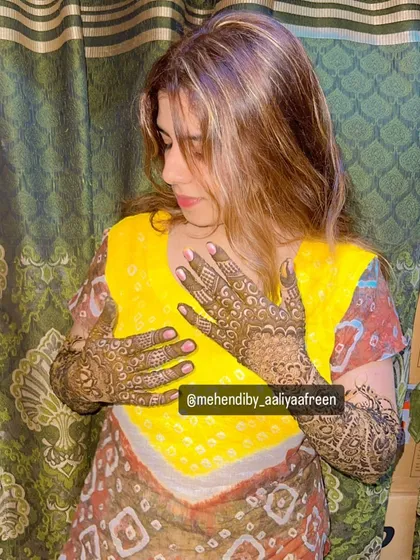 The beautiful bride Ayesha, showcasing her full bridal mehendi that we designed for her special day.