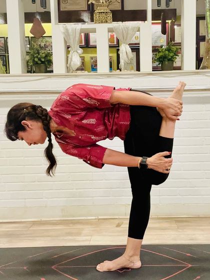 "Yoga is the stilling of the mind's fluctuations." This standing forward bend, a deep stretch for the hamstrings, embodies this principle. Desi Yoga reminds us that all you need is your breath, body, and belief to return to yourself.