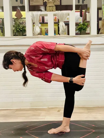 "Yoga is the stilling of the mind's fluctuations." This standing forward bend, a deep stretch for the hamstrings, embodies this principle. Desi Yoga reminds us that all you need is your breath, body, and belief to return to yourself.