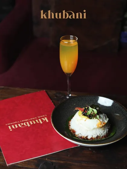 Soothing, satiating, and unspeakably delicious. I serve memories with exquisite taste, like this beautifully plated rice dish paired with a refreshing cocktail.