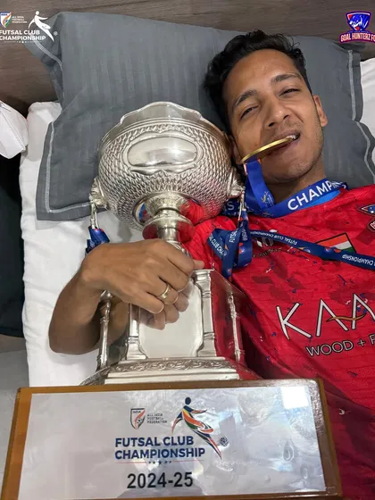 The sweet taste of victory. Biting the gold medal with the championship trophy by our side, a dream turned into reality.