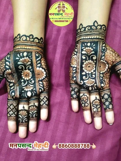 This design features bold floral patterns on the back of the hands. The dark henna stain makes the design pop, perfect for any festive occasion.