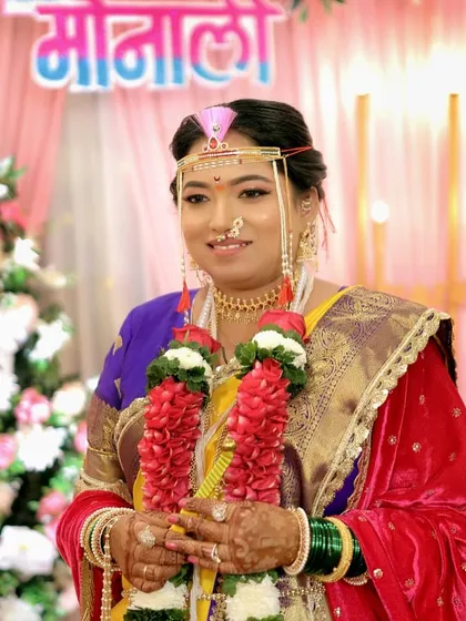 The final look of a radiant bride, ready for her wedding ceremony in a traditional yellow Nauvari saree.