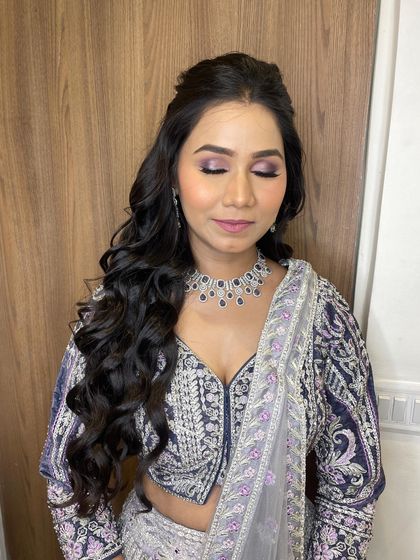 A stunning no-filter look for an engagement party. The purple-toned eye makeup adds a pop of color, while the skin remains natural and fresh.