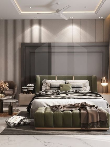 This luxury bedroom design for a residence in Rohtak combines soft, earthy tones with clean, modern lines. A large upholstered headboard, a cozy seating nook, and floor-to-ceiling windows create a tranquil and sophisticated space with a view.