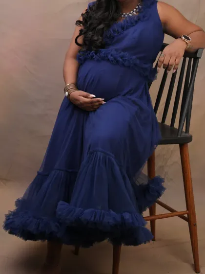 A versatile two-in-one navy blue dress that can be worn as a chic frock or a full-length gown. The ruffle details add a touch of modern flair.