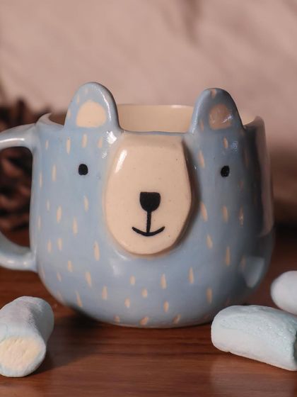 This cute, hand-painted bear mug is perfect for a cozy cup of hot chocolate.