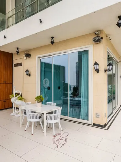 A full view of the terrace, highlighting the different seating areas and the beautiful water feature. The design is a perfect blend of luxury, comfort, and nature.