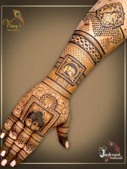A unique back-of-hand design with square frames featuring elephant motifs. The use of geometric shapes gives this traditional design a modern twist.