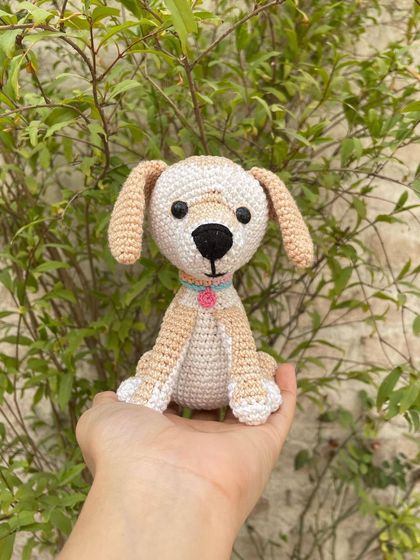 This sweet little crochet dog is a perfect gift for any dog lover. I made this one with soft beige and white yarn and gave it a cute little collar with a charm.