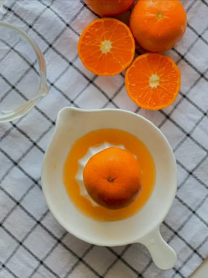 The process of creating my orange-flavored cakes begins with juicing fresh oranges by hand to ensure the most authentic and vibrant taste.