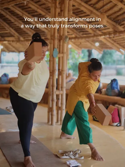 You will learn to understand alignment in a way that truly transforms poses. Here, students use blocks in Trikonasana (Triangle Pose) to learn how to properly ground the body and extend the spine.