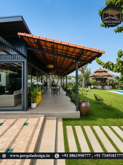 An expansive patio covered by a long, tiled-roof pergola, overlooking a beautiful lawn and pool. This is the ultimate outdoor entertainment space, offering ample shade and a resort-like feel.
