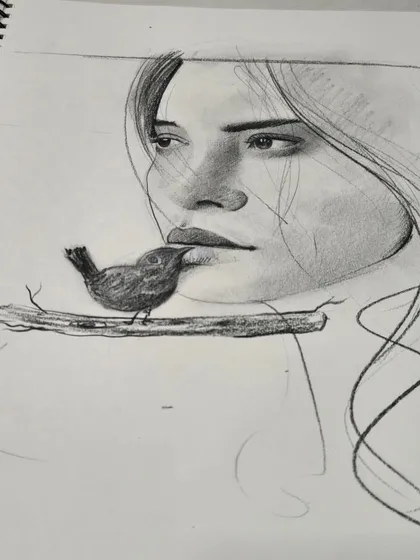 A beautiful pencil sketch in a student's sketchbook, demonstrating the foundational skills of portraiture and shading that we teach in our drawing classes.